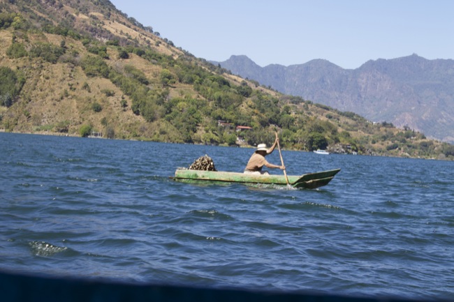 A fisherman in a dugout canoe on Lake Atitlán near Santiago, Guatemala.