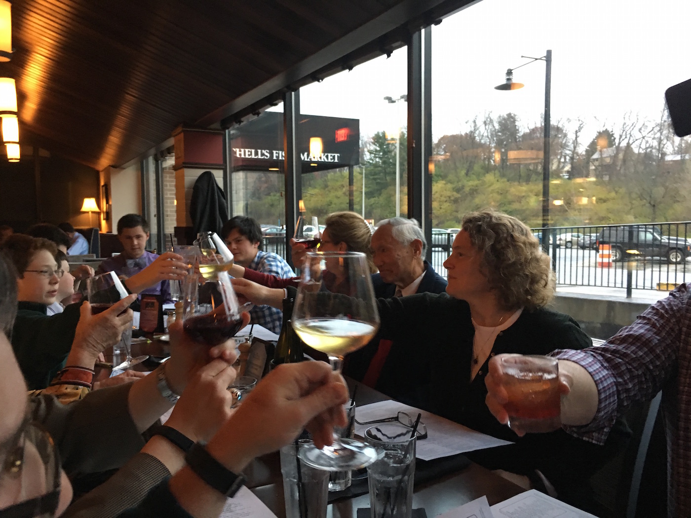 Glasses raised in a toast with Janairo family at Mitchell's Fish Market at the Galleria in Mount Lebanon, Pennsylvania