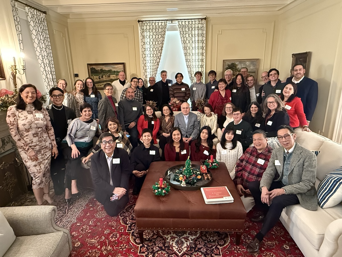 A large gathering of people in a living room